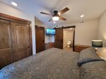 Master bedroom with large smart TV